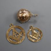 A 9ct and white metal masonic ball pendant and two 9ct gold masonic pendants.