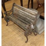 A child's Victorian style slatted wooden bench, with cast iron stand W.63cm