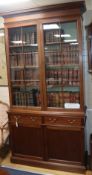 A pair of George III and later mahogany bookcases, each having glazed upper part over a pair of