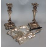 A pair of plated candlesticks, a crumb scoop and a presentation trowel