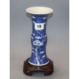 A Chinese blue and white 'prunus' beaker vase, 19th century, wood stand height 20cm excluding