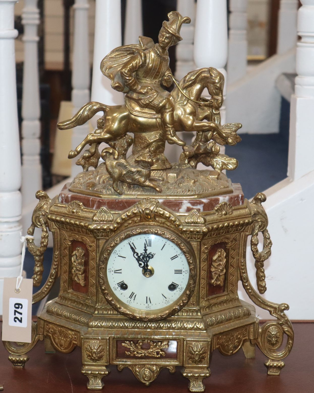 A French gilt metal and marble mantel clock