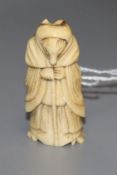 An 18th/19th century staghorn netsuke of a fox dressed as a woman