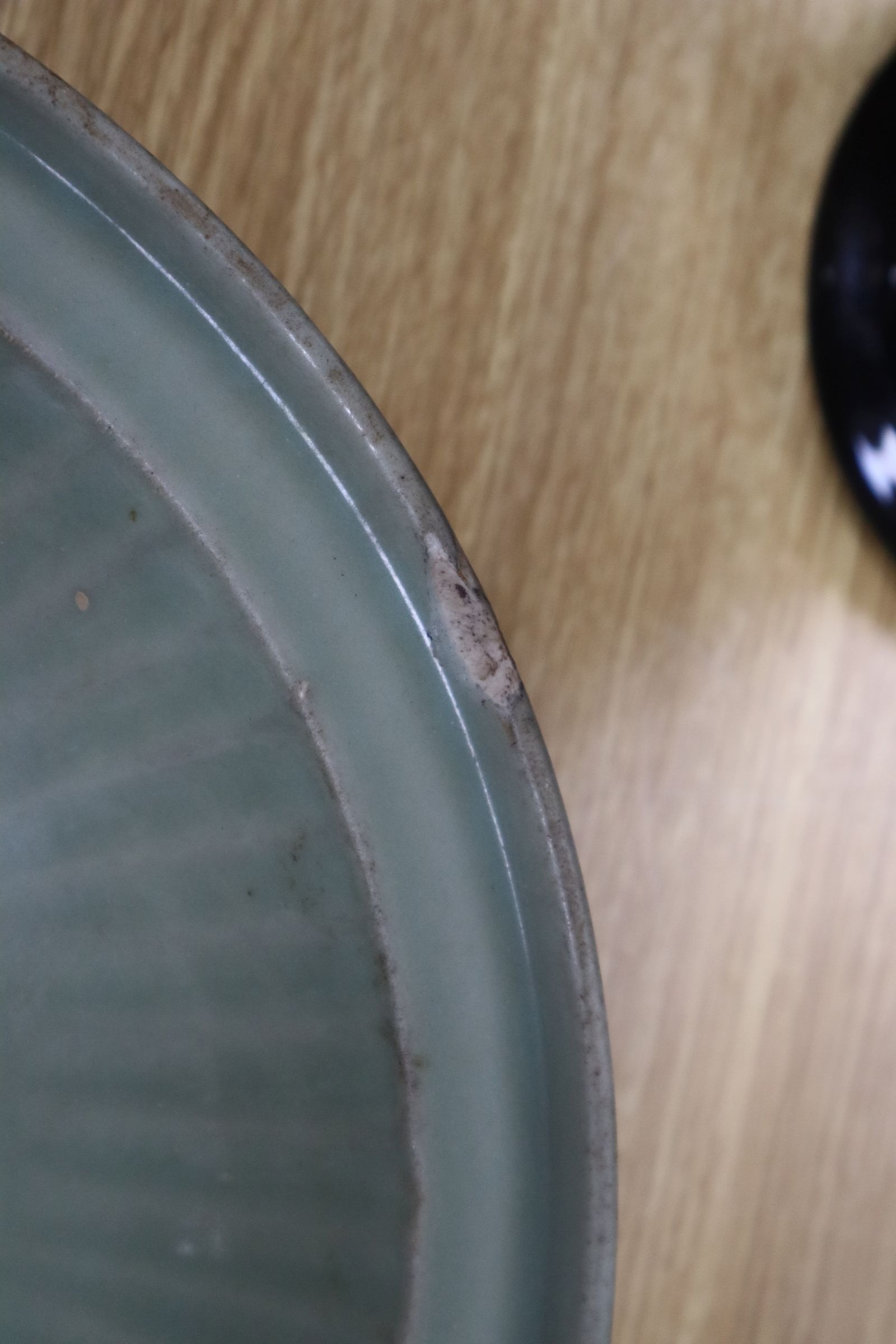 A Chinese Longquan celadon dish, Ming - Image 4 of 5