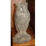 A pair of reconstituted stone owl garden ornaments, height 44cm