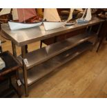 An Industrial design stainless steel three tier table W.218cm