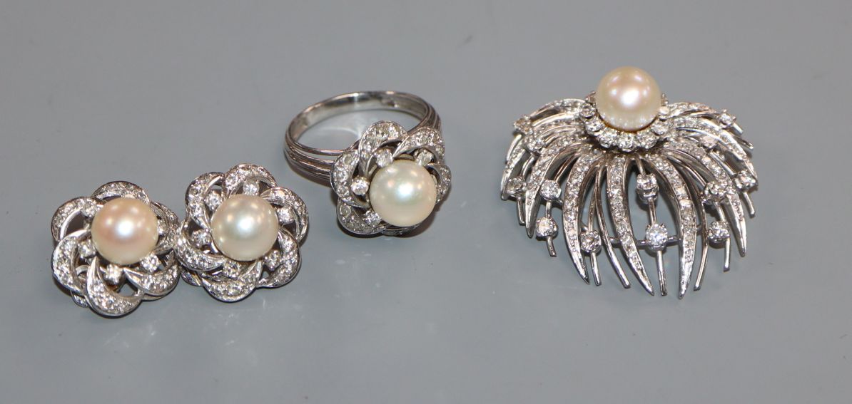 A modern suite of white metal, cultured pearl and diamond jewellery, comprising a ring, brooch and