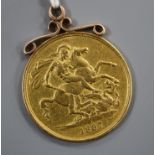 A Victorian gold 1887 two pound piece, with yellow metal scroll pendant mount, gross 16.5 grams.