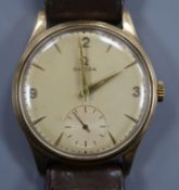 A gentleman's 1950's 9ct gold Omega manual wind wrist watch, on leather strap with Omega buckle,