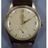 A gentleman's 1950's 9ct gold Omega manual wind wrist watch, on leather strap with Omega buckle,