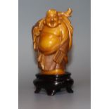 A Japanese stained ivory figure of Budai, boxed