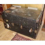 A 1920's leather and canvas covered travelling trunk / wardrobe W.105cm