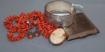 A silver face powder case, a Victorian silver bangle, a cameo, coral necklace, loose coral, and a