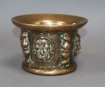 A Spanish bronze mortar cast with masks and buttresses (probably 16th or 17th century) diameter 14.