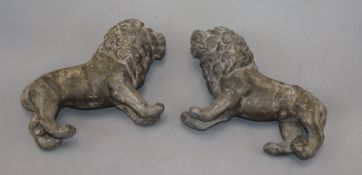 A pair of 19th century solid lead medals of lions rampant length 20cm