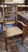 A set of eight Lancashire ash and beech rush seated spindle back dining chairs (two with arms)