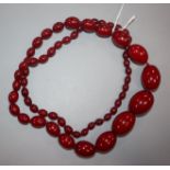 A single strand graduated simulated cherry amber necklace, gross weight 95 grams, 86cm.
