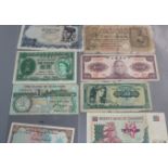 A collection of banknotes, coins and tokens.