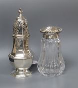 A late Victorian silver octagonal, London, 1890 caster and a German sterling mounted glass sugar