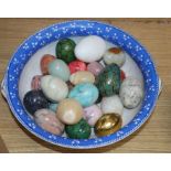 A quantity of hardstone eggs in a bowl