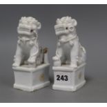 A pair of Chinese blanc de chine Buddhist lion joss-stick holders, losses