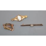 A 15ct gold-mounted cameo brooch, a 9ct gold harp brooch and a pearl and diamond-set bar brooch.