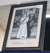 Royal Interest, a full-length formal photographic portrait of the Queen and Prince Philip, signed