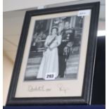 Royal Interest, a full-length formal photographic portrait of the Queen and Prince Philip, signed