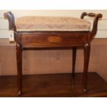 An Edwardian box seat piano stool