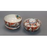 A pair of Imari bowls and covers