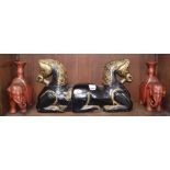 A Chinese carved wood horse group and a pair of lacquered elephant candlesticks