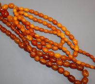 A long single strand amber bead necklace and one other amber bead necklace, gross weight, 131 grams,