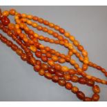 A long single strand amber bead necklace and one other amber bead necklace, gross weight, 131 grams,