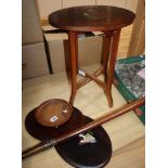 An inlaid figural side table with two matching plaques and another similar plaque (4)