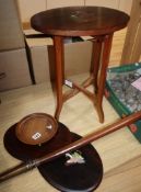 An inlaid figural side table with two matching plaques and another similar plaque (4)