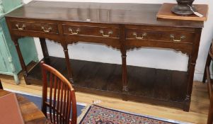 An 18th century oak three drawer potboard low dresser W.182cm