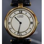 A lady's silver gilt Must de Cartier quartz wrist watch, with deployment clasp, in Cartier box.