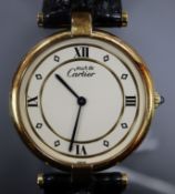 A lady's silver gilt Must de Cartier quartz wrist watch, with deployment clasp, in Cartier box.