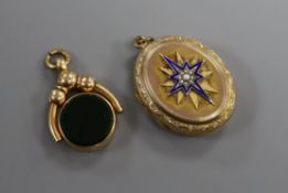 A Victorian yellow metal, seed pearl and enamel oval locket and a yellow metal, carnelian and