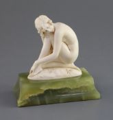 Ferdinand Preiss. An Art Deco carved ivory figure of a crouching female nude, on green