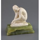 Ferdinand Preiss. An Art Deco carved ivory figure of a crouching female nude, on green