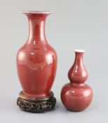 Two Chinese sang de boeuf glazed vases, 18th/19th century, the largest of baluster shape, unglazed