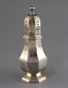 A George I Brittania standard silver octagonal castor, by Charles Adam, with turned finial,