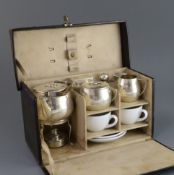 A cased early 20th century German 935 standard silver and porcelain travelling picnic set, fitted