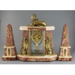 An early 20th century French ormolu and marble Egyptian revival clock garniture, with portico