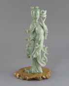 A Chinese jadeite figure of a lady, early 20th century, in standing pose carrying fish, attached