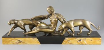 Michel Decoux (1837-1924). An Art Deco bronze group of a reclining woman with two panthers, on