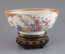 A Chinese export famille rose bowl, Qianlong period, painted with court figures in a garden and