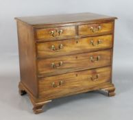 A George III mahogany chest, of two short and three graduated long drawers, on ogee bracket feet,