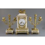 An early 20th century French ormolu and white marble clock garniture, the architectural cased